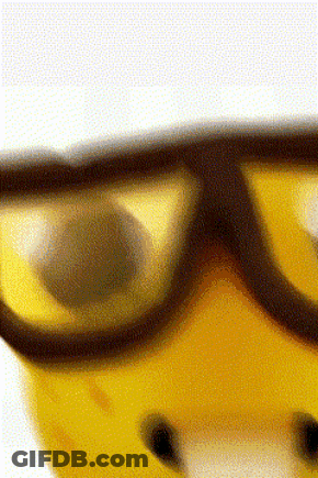 A Close Up Of A Pair Of Safety Goggles On A Yellow Helmet GIF