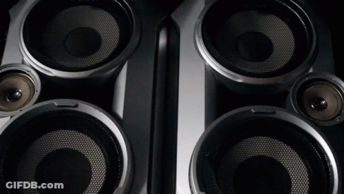 A Close Up Of A Pair Of Speakers With A Mesh Covering GIF