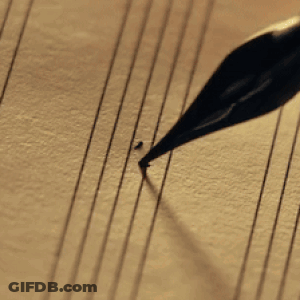 A Close Up Of A Pen Writing The Letter G GIF