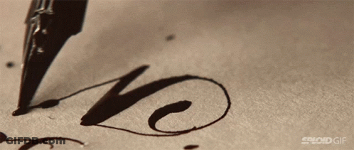 A Close Up Of A Pen Writing The Word Love GIF