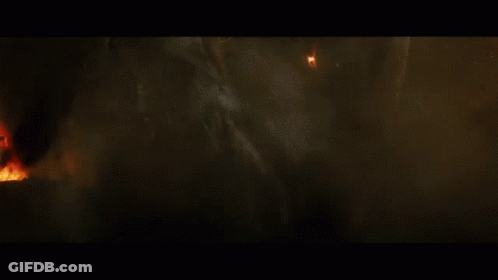 A Close Up Of A Person Being Struck By Lightning In A Dark Room GIF