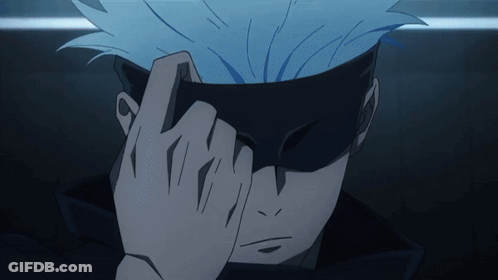 A Close Up Of A Person Covering Their Face With Their Hands GIF