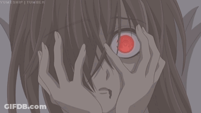 A Close Up Of A Person Covering Their Face With Their Hands With A Red Eye GIF