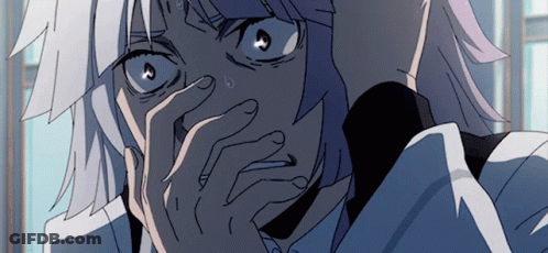 A Close Up Of A Person Covering Their Face With Their Hands GIF