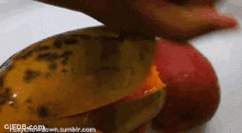 A Close Up Of A Person Cutting A Fruit With The Website Roxychowdown.tumblr.com In The Lower Right Corner GIF