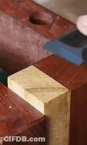 Person Cutting Wood With Hammer Close Up GIF