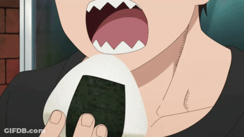 A Close Up Of A Person Eating A Ball Of Food With Their Mouth Open GIF