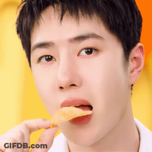 A Close Up Of A Person Eating A Slice Of Food GIF