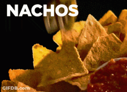 A Close Up Of A Person Eating Nachos With A Black Background GIF