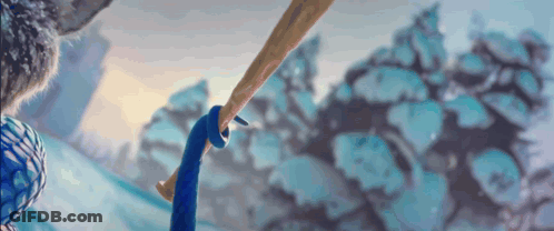 A Close Up Of A Person Holding A Bat In A Snowy Forest GIF