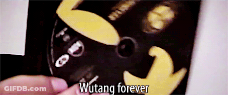 A Close Up Of A Person Holding A Cd That Says Wutang Forever GIF