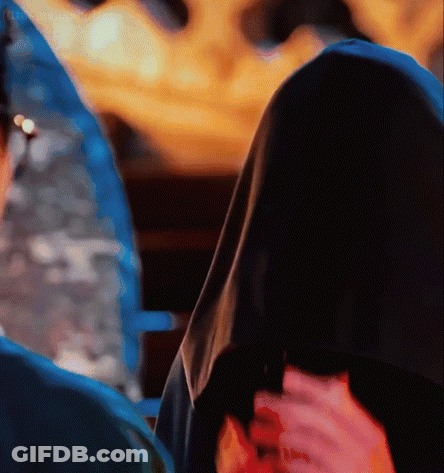 A Close Up Of A Person Holding A Flower GIF