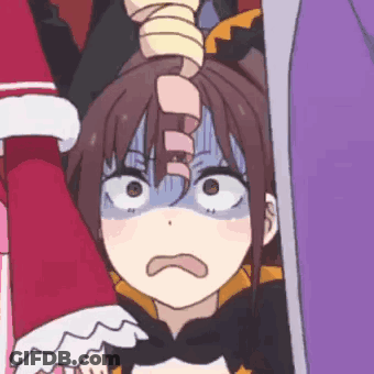 A Close Up Of A Person Holding A Girl 'S Head With A Surprised Look On Their Face . GIF