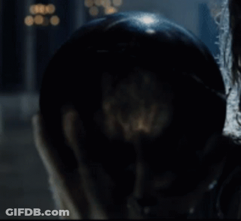 A Close Up Of A Person Holding A Glass Ball In Their Hand GIF