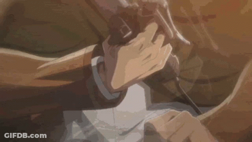 A Close Up Of A Person Holding A Gun In Their Hands . GIF