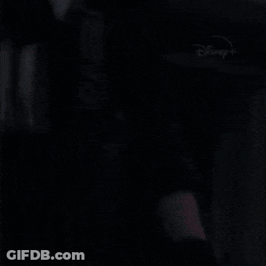 A Close Up Of A Person Holding A Gun With Disney + Written On The Bottom GIF