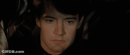 A Close Up Of A Person Holding A Knife In Their Mouth GIF