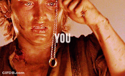 A Close Up Of A Person Holding A Necklace With The Word You Written On It GIF