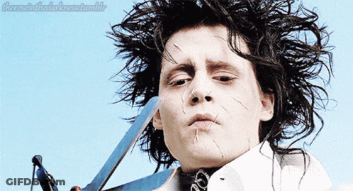 A Close Up Of A Person Holding A Pair Of Scissors With The Words " There Is In The Darkness Tumblr " Above Them GIF