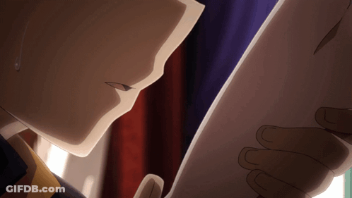 A Close Up Of A Person Holding A Piece Of Paper In Their Hand GIF