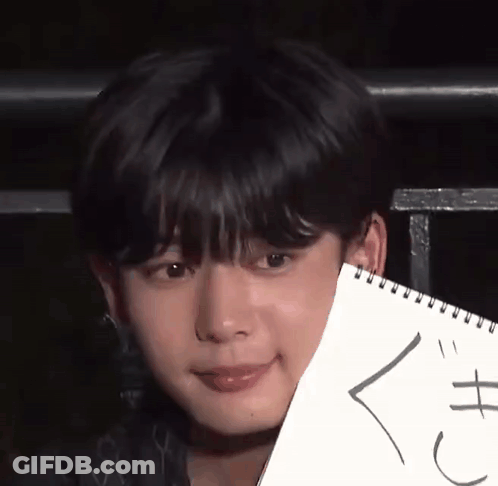 A Close Up Of A Person Holding A Piece Of Paper That Says ' X ' On It GIF