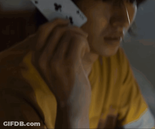 A Close Up Of A Person Holding A Playing Card With The Number 4 On It GIF