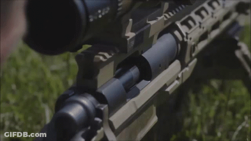 A Close Up Of A Person Holding A Rifle With A Scope That Says ' Tactical ' On It GIF
