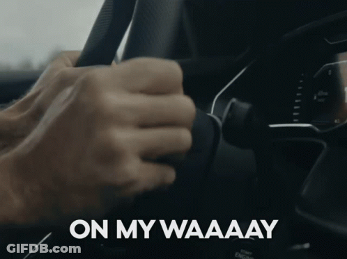 A Close Up Of A Person Holding A Steering Wheel With The Words On My Waaaay Written On The Bottom GIF