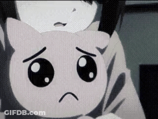 A Close Up Of A Person Holding A Stuffed Animal With A Sad Face . GIF