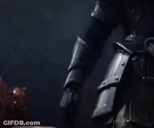 A Close Up Of A Person Holding A Sword In Their Right Hand GIF