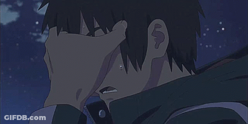 A Close Up Of A Person Holding Another Person 'S Hand To Their Face . GIF