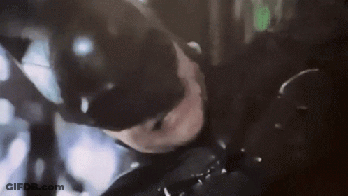 A Close Up Of A Person In A Batman Costume GIF