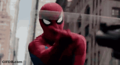 A Close Up Of A Person In A Spiderman Costume Pointing . GIF