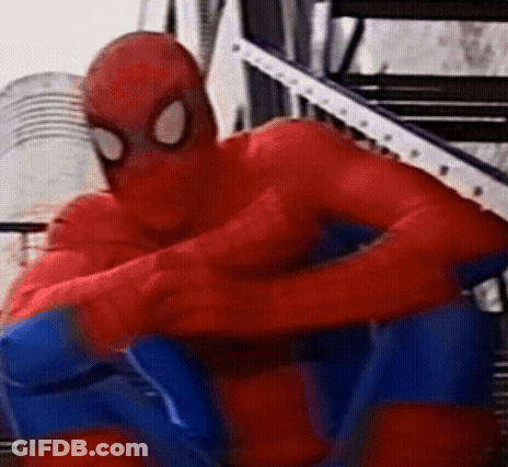 A Close Up Of A Person In A Spiderman Costume Sitting On A Staircase . GIF