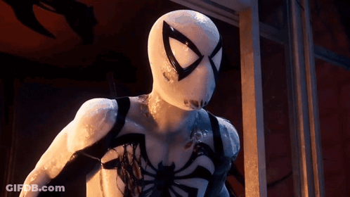 A Close Up Of A Person In A White Spiderman Costume GIF