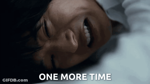 A Close Up Of A Person Laying Down With The Words One More Time Written Below Them GIF