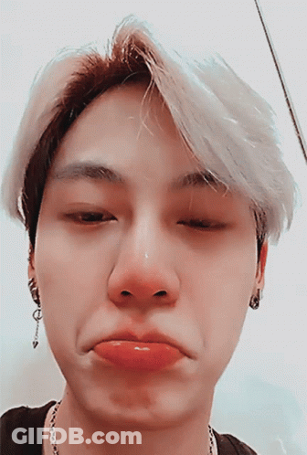 A Close Up Of A Person Making A Face GIF