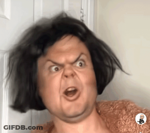 A Close Up Of A Person Making A Funny Face With A Picture Of A Man In The Corner GIF