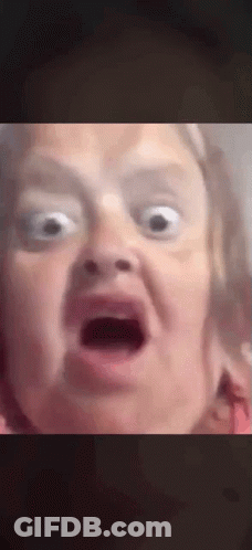 A Close Up Of A Person Making A Funny Face With Their Mouth Open . GIF