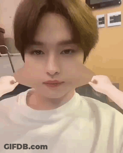 A Close Up Of A Person Making A Funny Face With Their Mouth Open . GIF