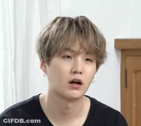 A Close Up Of A Person Making A Funny Face With Their Mouth Open . GIF