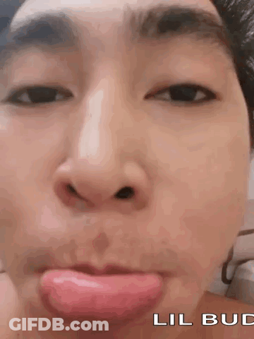 A Close Up Of A Person Making A Funny Face With Their Tongue Out . GIF