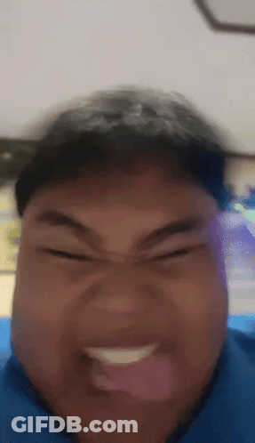 A Close Up Of A Person Making A Funny Face With Their Tongue Out GIF