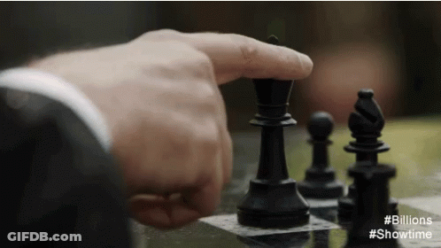 A Close Up Of A Person Playing A Game Of Chess With # Billions Showtime GIF