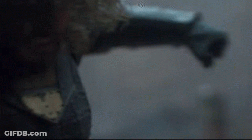 A Close Up Of A Person 'S Arm And Leg In A Dark Room . GIF