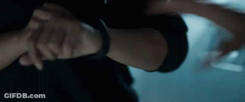 A Close Up Of A Person 'S Arm With A Black Watch On It GIF