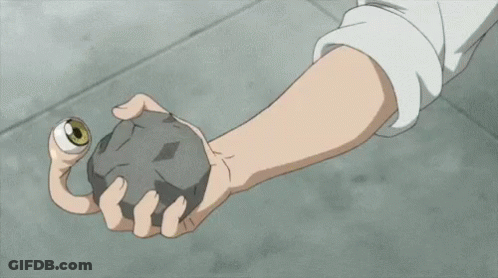 A Close Up Of A Person 'S Arm With Muscles And Claws Holding A Rock . GIF