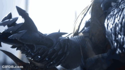 A Close Up Of A Person 'S Arm With Sharp Claws And Feathers GIF
