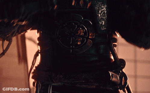A Close Up Of A Person 'S Armor With A Circular Design GIF