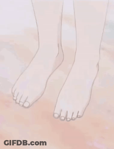 A Close Up Of A Person 'S Bare Feet On A Sandy Surface . GIF